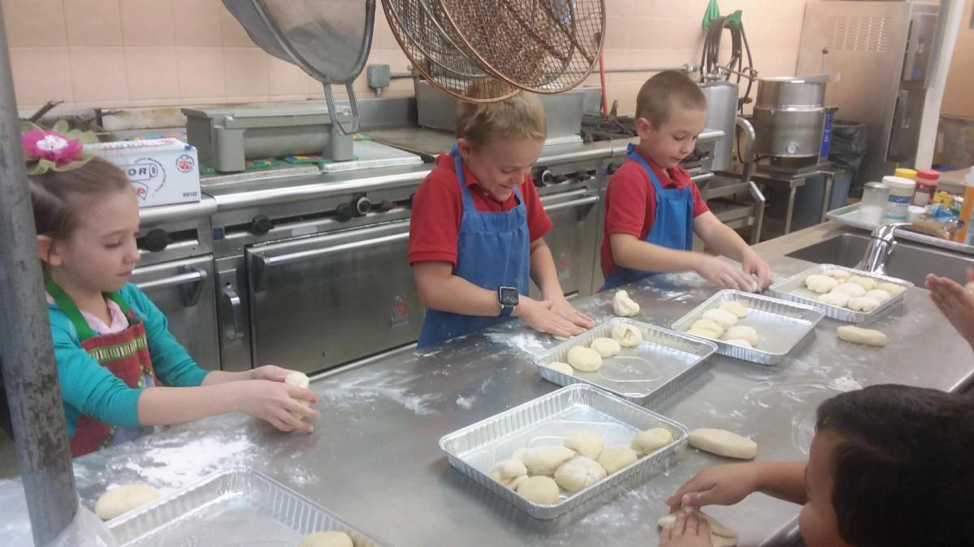 HMS Richards School Students Make Bread Rolls as a Fundraiser for the Philippines