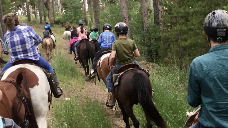 FREE HORSEBACK RIDES BRING COMMUNITY YOUTH TO MILLS SPRING RANCH