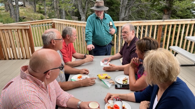 Group eating at a table outside