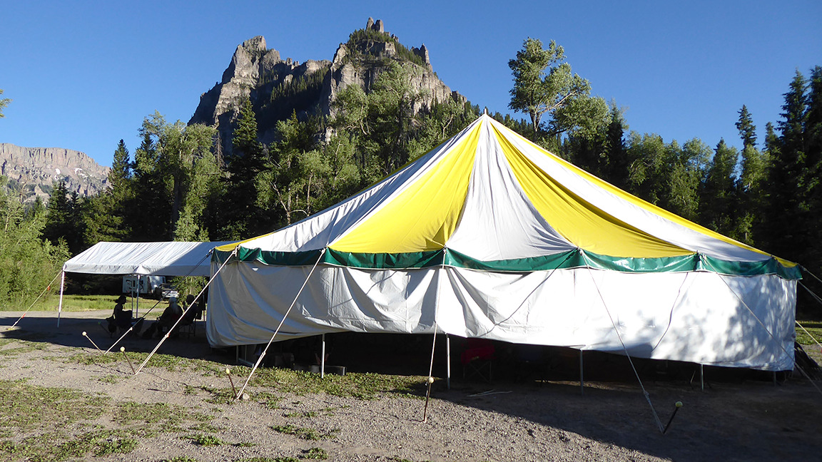 PRAISE SANG IN THE WILDERNESS AT THE COWBOY CAMP MEETING