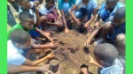 School-Children-preparing-soil-for-tree-seedlings-after-learning-about-environmental-conservation-in-ADRA-Mozambique